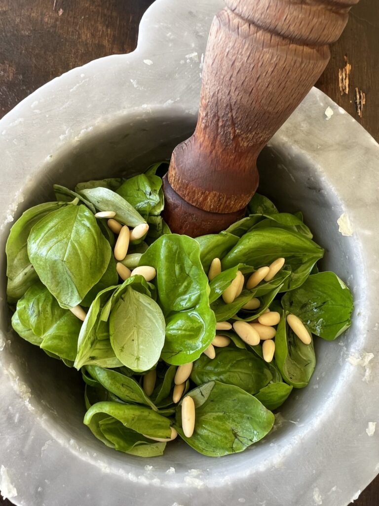 Pesto ingredients for Pesto in a pestle and mortar