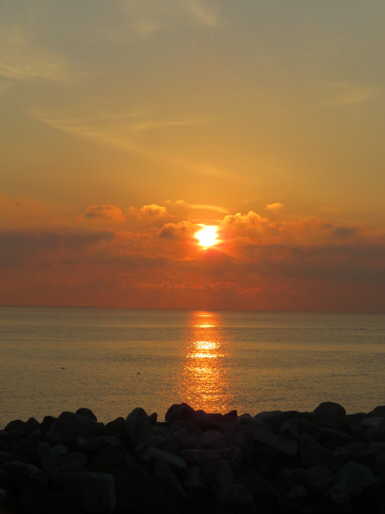 Gorgeous bright orange sunset in Riomaggiore