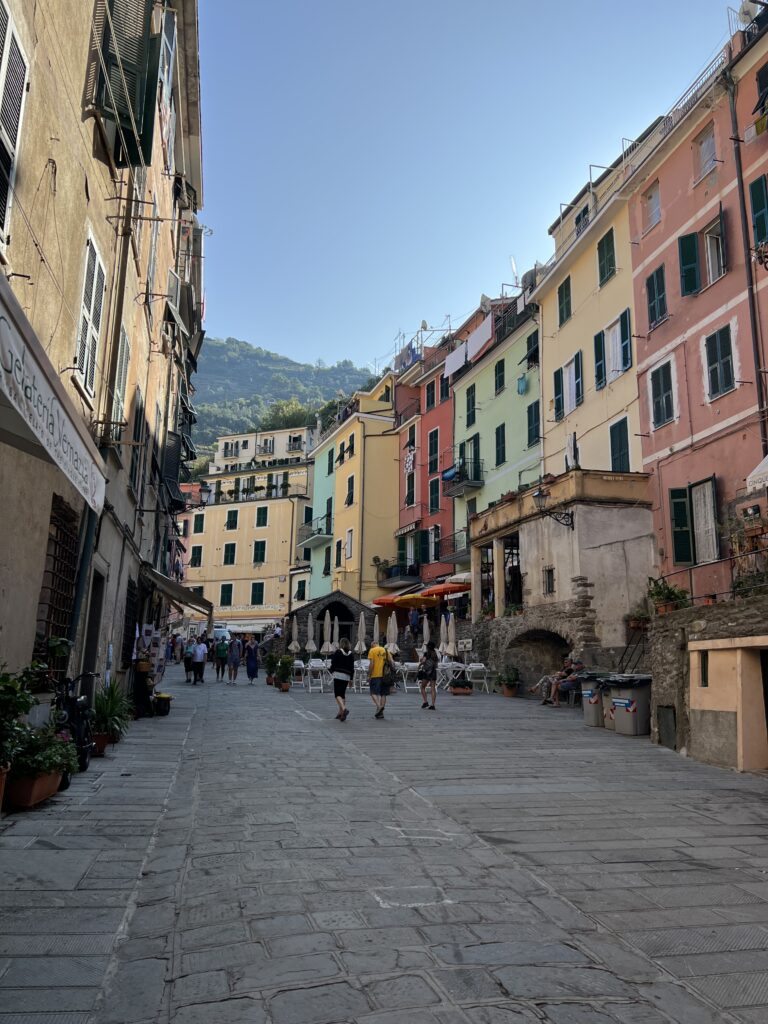 The pathway from Vernazza station to Vernazza harbour with the colourful shops either side 