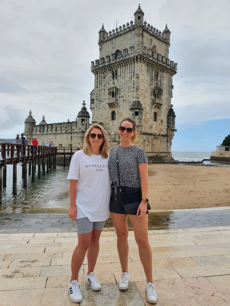 Standing in front of Torre De Belém in Lisbon