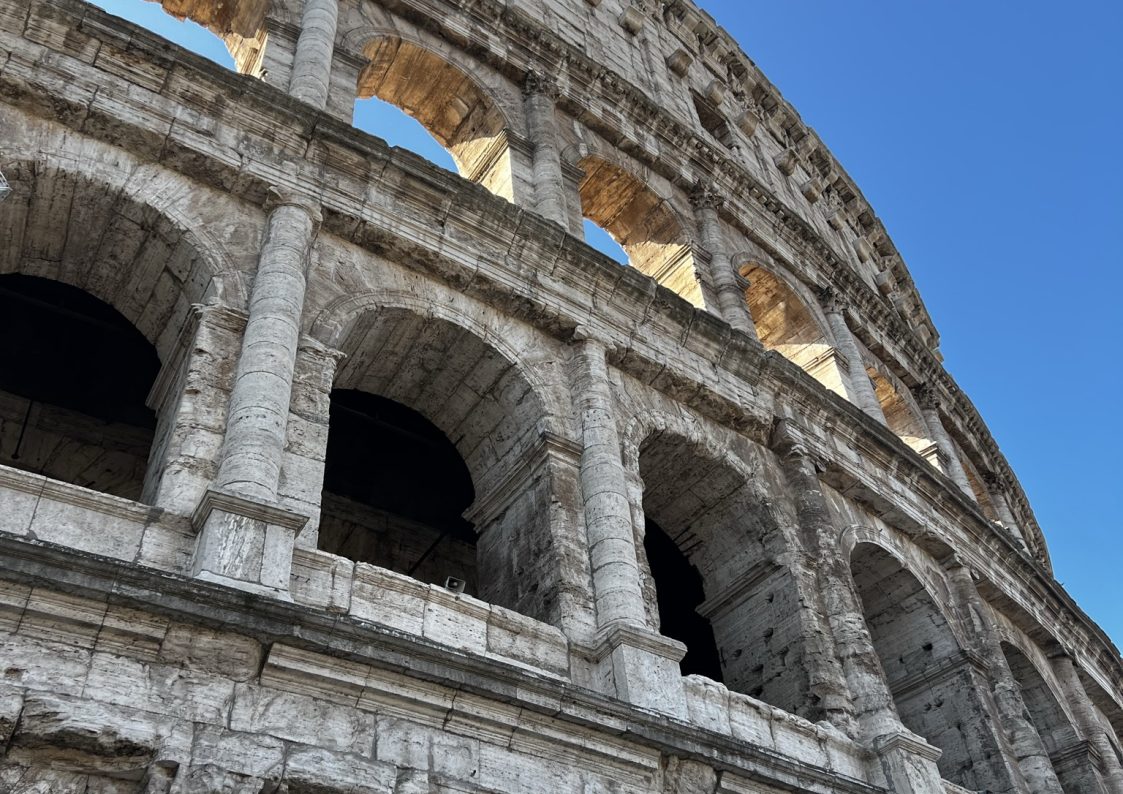 Close up for the Colosseum with bright blue skies